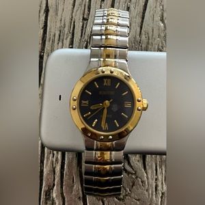 silver and gold watch with black face